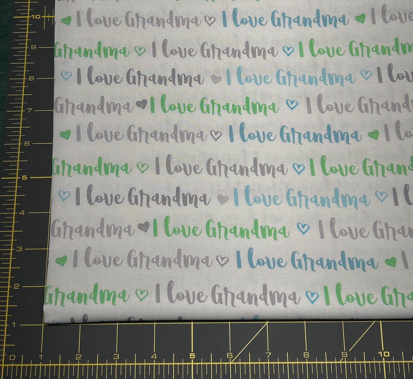 I Love Grandma Words Blue Green Gray on White Continuous cuts.